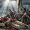 Jesus Christ - JAVASCAPE AI - www.javascapeai.com Jesus Christ sleeping in a wooden boat while His disciples struggle during a violent storm at sea.