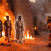 Shadrach, Meshach, and Abed-Nego emerge unharmed from a blazing furnace beside a fourth heavenly figure as King Nebuchadnezzar watches in astonishment.