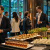 Business professionals networking beside a catered buffet at a modern corporate reception.